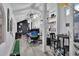 Bright home office featuring vaulted ceilings, built-in shelving, desk, and a view to the backyard at 204 Green Lake Cir, Longwood, FL 32779
