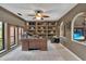 Home office with built-in shelving, neutral walls, and a large window view at 204 Green Lake Cir, Longwood, FL 32779