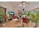 Bright sunroom with tile floors, fan, and lots of natural light streaming through multiple windows at 204 Green Lake Cir, Longwood, FL 32779