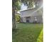 The property features a vast green backyard perfect for relaxation and recreation at 2120 Lilipetal Ct, Sanford, FL 32771