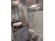 Modern bathroom features a bowl sink, marble-look tiled shower, and updated fixtures at 2120 Lilipetal Ct, Sanford, FL 32771