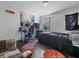 Cozy bedroom with dark wood floors, natural light, and comfortable furnishings at 2120 Lilipetal Ct, Sanford, FL 32771