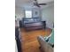 Spacious bedroom with hardwood floors, ceiling fan, and natural light from large window at 2120 Lilipetal Ct, Sanford, FL 32771