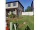Charming home with green shutters, a landscaped yard, and a white picket fence at 2120 Lilipetal Ct, Sanford, FL 32771
