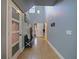 Spacious foyer with tiled floor, coat closet, and staircase to the upper level at 2120 Lilipetal Ct, Sanford, FL 32771