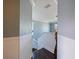 Hallway with bead-board wainscoting leads to an upstairs area at 2120 Lilipetal Ct, Sanford, FL 32771