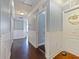 Hallway featuring wood floors, bead-board wainscoting, and doors leading to other rooms at 2120 Lilipetal Ct, Sanford, FL 32771