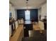 Bright kitchen with white cabinets, dark countertops and modern island provides workspace at 2120 Lilipetal Ct, Sanford, FL 32771