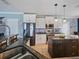 Well-lit kitchen features white cabinets, stainless steel appliances, granite counters and an island at 2120 Lilipetal Ct, Sanford, FL 32771