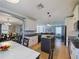 Open-concept kitchen with island, flowing into the dining room and living area for easy entertaining at 2120 Lilipetal Ct, Sanford, FL 32771
