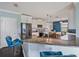 Bright kitchen with white cabinets, stainless steel appliances, and a granite-topped island with bar seating at 2120 Lilipetal Ct, Sanford, FL 32771
