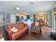 Open-concept living area featuring a kitchen, dining space, and comfortable seating area for relaxation at 2120 Lilipetal Ct, Sanford, FL 32771