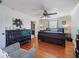 Bedroom featuring wood floors, ceiling fan and space for a sitting area at 2120 Lilipetal Ct, Sanford, FL 32771
