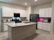 Bright kitchen featuring stainless steel appliances and ample counter space at 2252 Tay Wes Dr, St Cloud, FL 34771