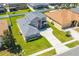 Stunning home with a sprawling lawn, neutral color palette, and manicured landscaping from above at 2340 Hinsdale Dr, Kissimmee, FL 34741