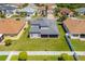 Features a covered patio, spacious green yard, and a neutral color palette at 2340 Hinsdale Dr, Kissimmee, FL 34741