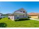 Charming home with lush landscaping, neutral color palette, and a well-manicured lawn at 2340 Hinsdale Dr, Kissimmee, FL 34741
