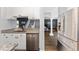 Bright kitchen with granite countertops, stainless steel appliances, and open layout to stairs and office at 2340 Hinsdale Dr, Kissimmee, FL 34741