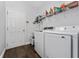 Spacious laundry room with plenty of storage and white washer and dryer at 2340 Hinsdale Dr, Kissimmee, FL 34741