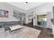 Spacious living room with a sliding door to the patio, stairs, and open concept to the kitchen at 2340 Hinsdale Dr, Kissimmee, FL 34741