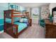 Fun bedroom features a wooden bunk bed, nautical decor, and bright accents, perfect for children at 2363 Distant Sun Trl, Kissimmee, FL 34747
