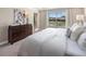 Bedroom with neutral colors, plush carpet, view to exterior and a walk in closet at 2367 Distant Sun Trl, Kissimmee, FL 34747