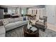 Open-concept living room with modern decor and easy access to the kitchen and dining room at 2367 Distant Sun Trl, Kissimmee, FL 34747