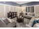 Elegant living room featuring neutral decor, accent wall and lots of natural light at 2367 Distant Sun Trl, Kissimmee, FL 34747