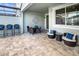 Covered patio area with comfortable seating, offering a relaxing outdoor space at 2367 Distant Sun Trl, Kissimmee, FL 34747