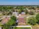 A serene neighborhood with lush trees, tidy houses, and proximity to local amenities at 2470 Pine Tree Circle Dr, Orange City, FL 32763