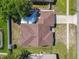 Aerial of house showing backyard, neighboring homes, and the overall layout of the property at 2470 Pine Tree Circle Dr, Orange City, FL 32763