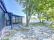 Spacious backyard with a screened porch and vinyl and chainlink fence, offering privacy at 2470 Pine Tree Circle Dr, Orange City, FL 32763