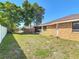 Spacious backyard with a well-kept lawn, mature trees, and privacy fencing at 2470 Pine Tree Circle Dr, Orange City, FL 32763