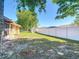 Expansive backyard featuring a white privacy fence and grassy area, perfect for outdoor activities at 2470 Pine Tree Circle Dr, Orange City, FL 32763