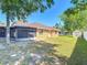 Brick home with a large backyard featuring a shed, and white fence, providing ample space at 2470 Pine Tree Circle Dr, Orange City, FL 32763