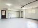 A large, well-lit garage featuring a water heater, garage door opener, and a window for natural light at 2470 Pine Tree Circle Dr, Orange City, FL 32763
