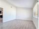 Spacious living room featuring wood-look tile flooring and a minimalist design at 2470 Pine Tree Circle Dr, Orange City, FL 32763