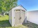 Durable storage shed with neutral color scheme, offering secure and convenient outdoor storage at 2470 Pine Tree Circle Dr, Orange City, FL 32763