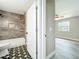Stylish bathroom featuring patterned floors, tiled shower with a built-in niche, and modern fixtures at 2647 Lake Landing Blvd, Eustis, FL 32726