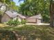 Inviting home with mature landscaping and a two-car garage at 2647 Lake Landing Blvd, Eustis, FL 32726