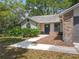 Charming single-story home with mature trees and a well-manicured lawn at 2647 Lake Landing Blvd, Eustis, FL 32726