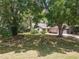 Inviting home exterior with lush landscaping and mature trees at 2647 Lake Landing Blvd, Eustis, FL 32726