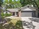 Charming single-story home featuring a two-car garage and well-maintained landscaping at 2647 Lake Landing Blvd, Eustis, FL 32726