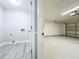 View into the laundry room and garage featuring ample storage space at 2647 Lake Landing Blvd, Eustis, FL 32726