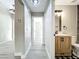 Hallway view to the bathroom and other rooms with modern finishes and light fixtures at 2647 Lake Landing Blvd, Eustis, FL 32726