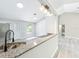 Bright kitchen featuring granite countertops and a stylish faucet at 2647 Lake Landing Blvd, Eustis, FL 32726