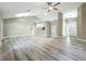 Large living room featuring a fan, recessed lights, and wood floors at 2647 Lake Landing Blvd, Eustis, FL 32726