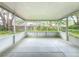View of the screened patio with a view to the backyard area at 2647 Lake Landing Blvd, Eustis, FL 32726