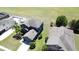 A charming two-story home has a well-manicured lawn, mature palm trees, and a two-car garage at 2865 Running Brook Cir, Kissimmee, FL 34744