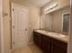Bathroom with double sinks and a granite countertop vanity at 2865 Running Brook Cir, Kissimmee, FL 34744